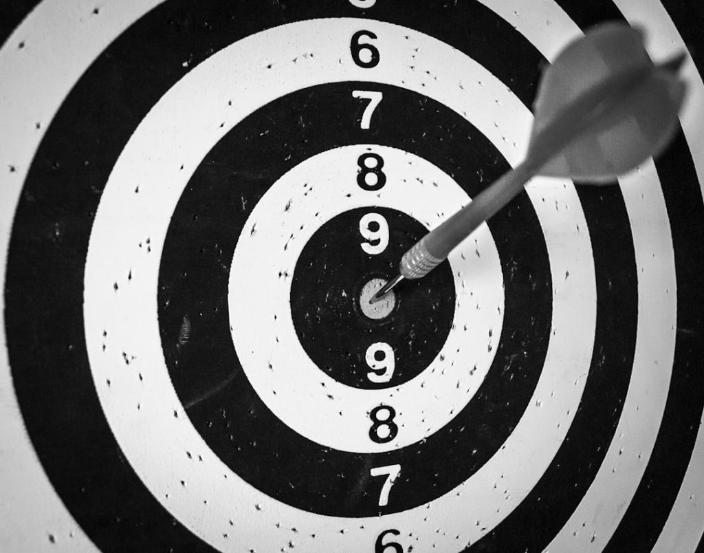 A dart hitting the centre of a target, symbolising focused account-based targeting