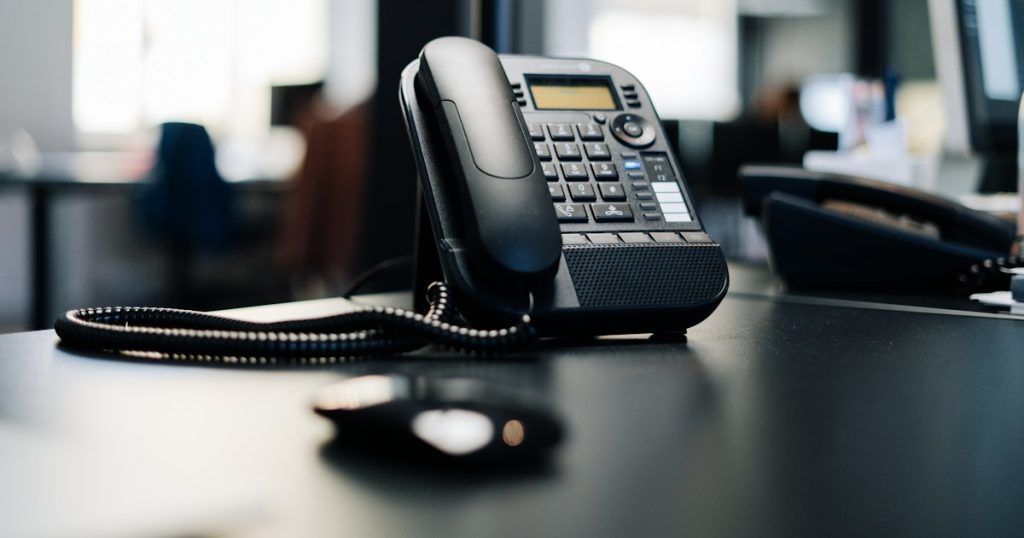 Desk phone used for outbound sales calls