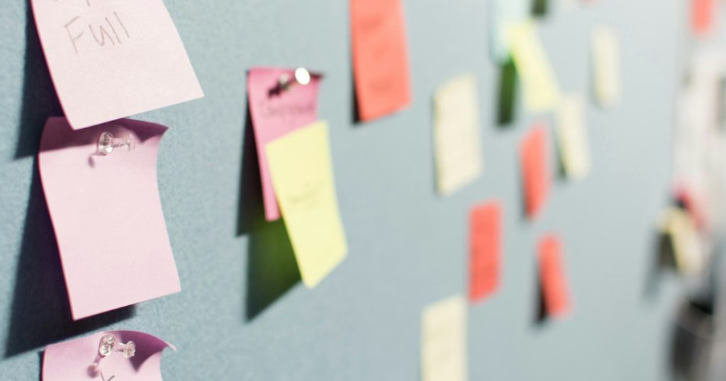 Colorful sticky notes pinned to a planning board