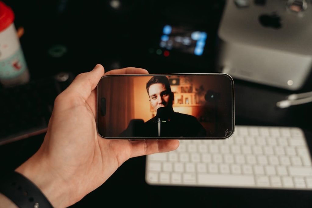 Person watching a video message on a smartphone